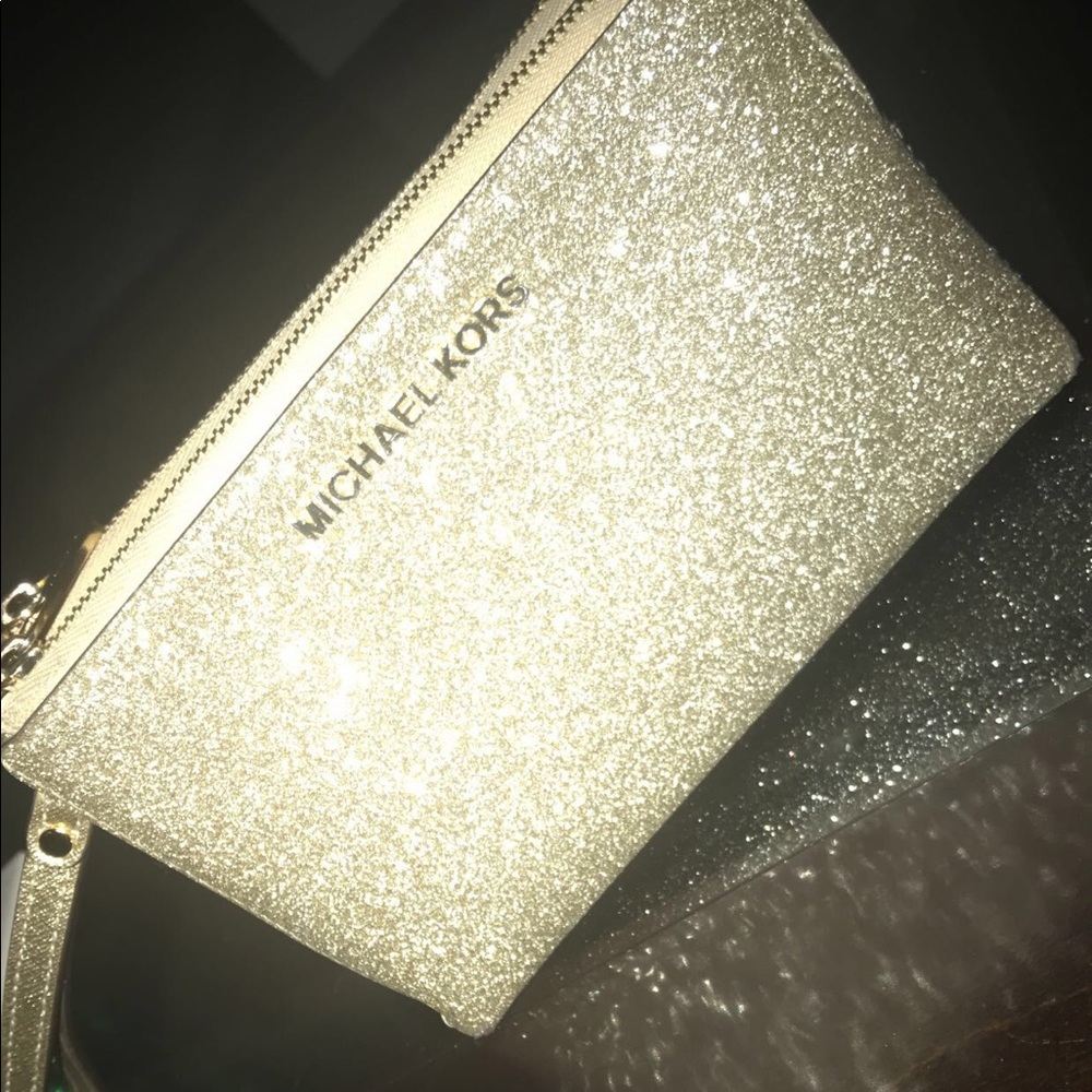 Michael kors glittery 2 sided wristlet wallet.